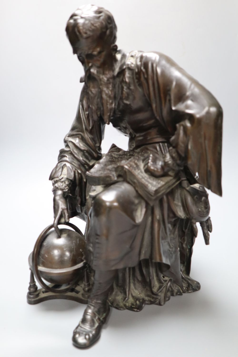 Jean Gout. A bronze model of a scholar painting to a globe, height 34cm